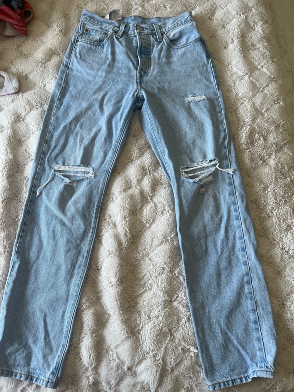 Levi 501 jeans.

Light Blue Straight Leg Jeans with Knee Distressing
